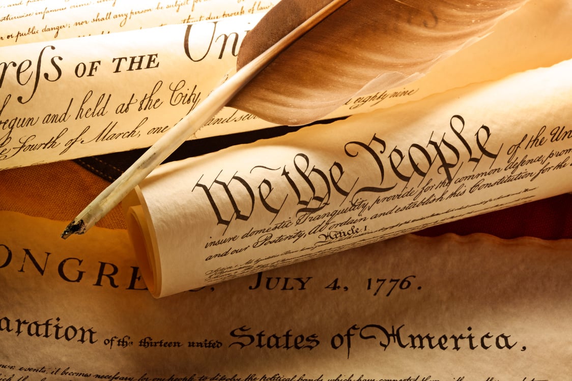 Feather Quill On Top Of Founding Documents Of American Government